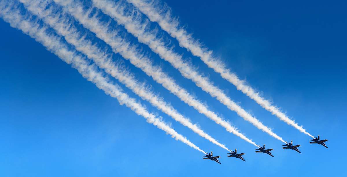 municipal pier five aircraft contrail san francisco